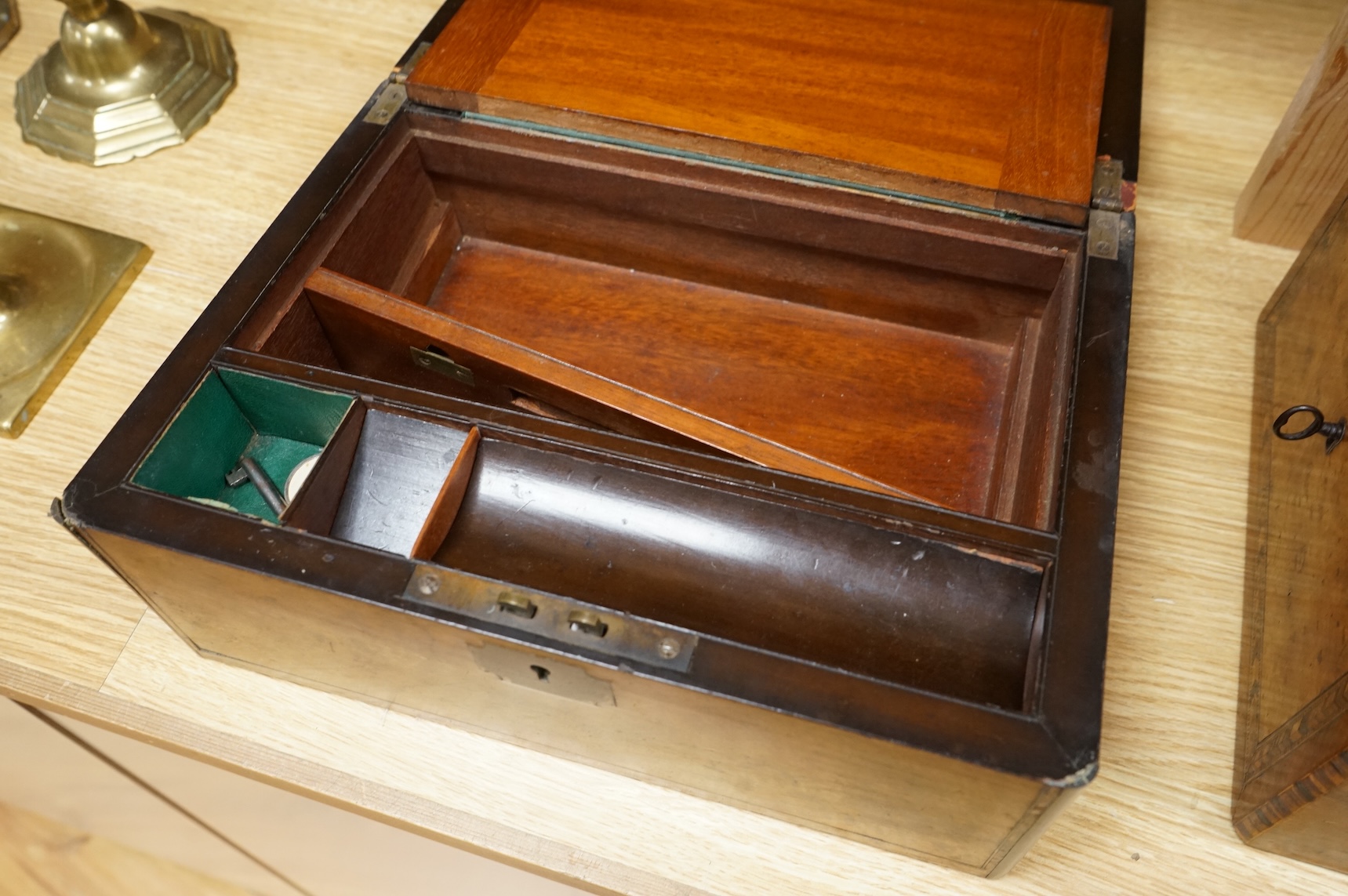 A walnut and German bandwork tea caddy, a brass bound walnut writing slope and an Art Deco Killarney inlaid trinket box, largest 15cm high, 30cm wide.